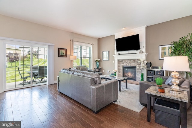 6039 Union Tunnel Dr, Harrisburg, PA 17111 - living area with a stone fireplace and dark wood-style floors