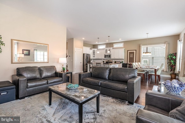 6039 Union Tunnel Dr, Harrisburg, PA 17111 - living room featuring light wood-style flooring, healthy amount of natural light, recessed lighting, baseboards, and a chandelier