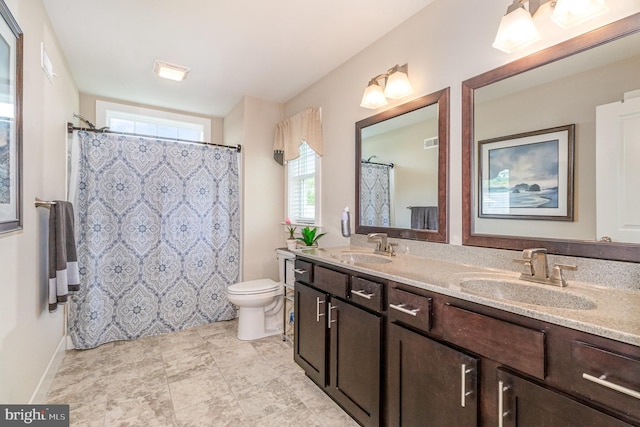 6039 Union Tunnel Dr, Harrisburg, PA 17111 - bathroom featuring double vanity, toilet, and a shower with curtain