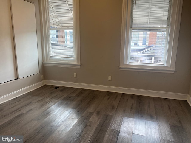 2333 W Firth St, Philadelphia, PA 19132 - unfurnished room featuring baseboards and dark wood-style floors