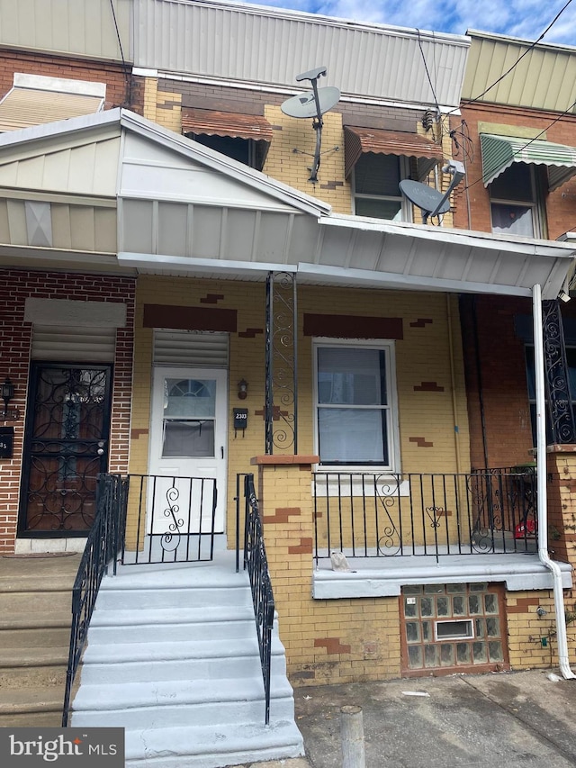 2333 W Firth St, Philadelphia, PA 19132 - view of exterior entry with covered porch and brick siding