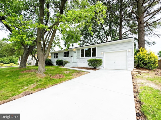 914 Townsend Blvd, Dover, DE 19901 - ranch-style house with an attached garage, driveway, a front yard, and brick siding