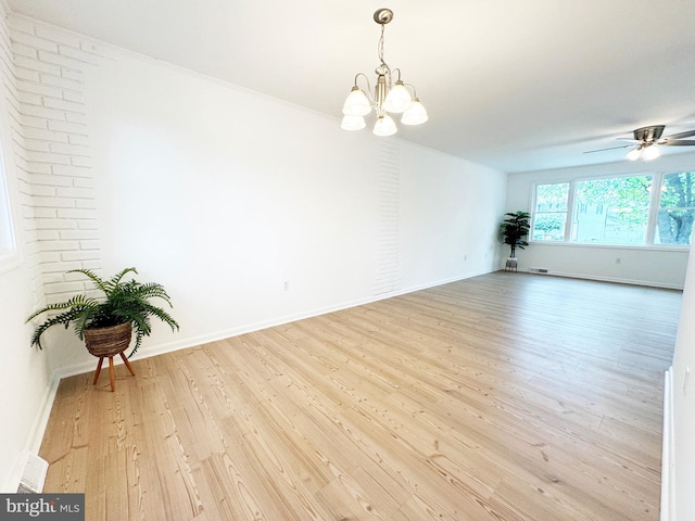 914 Townsend Blvd, Dover, DE 19901 - empty room featuring a chandelier, light wood finished floors, baseboards, and a ceiling fan