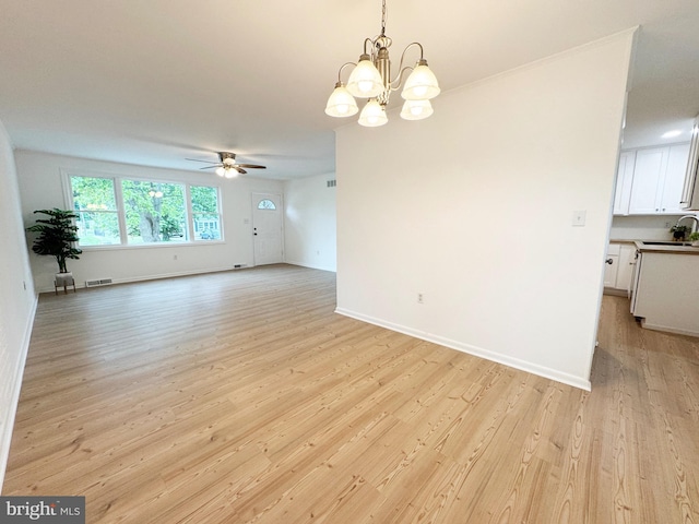914 Townsend Blvd, Dover, DE 19901 - empty room with a sink, a chandelier, a ceiling fan, and light wood finished floors