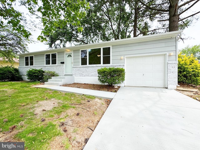 914 Townsend Blvd, Dover, DE 19901 - ranch-style house with driveway, a garage, and brick siding