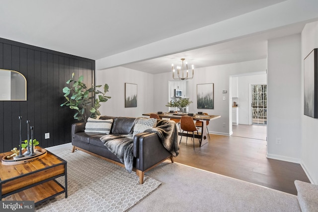 1123 Robin Hill Ct, Bel Air, MD 21015 - living area with a chandelier, baseboards, wood finished floors, and wood walls