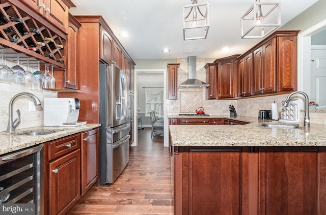 6202 Crofton Ct, Mechanicsburg, PA 17050 - kitchen featuring wine cooler, wall chimney range hood, stainless steel appliances, a sink, and wood finished floors