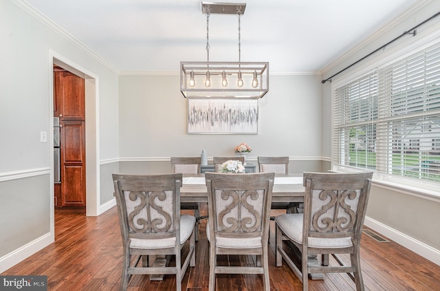 6202 Crofton Ct, Mechanicsburg, PA 17050 - dining area with dark wood finished floors, crown molding, and baseboards
