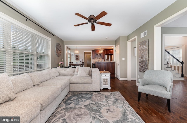 6202 Crofton Ct, Mechanicsburg, PA 17050 - living area with a ceiling fan, plenty of natural light, stairway, and dark wood-type flooring