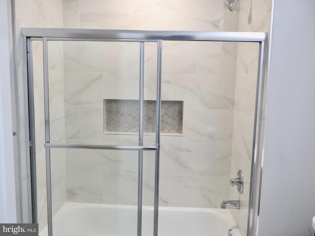 600 64th Ave, Capitol Heights, MD 20743 - bathroom featuring combined bath / shower with glass door and toilet