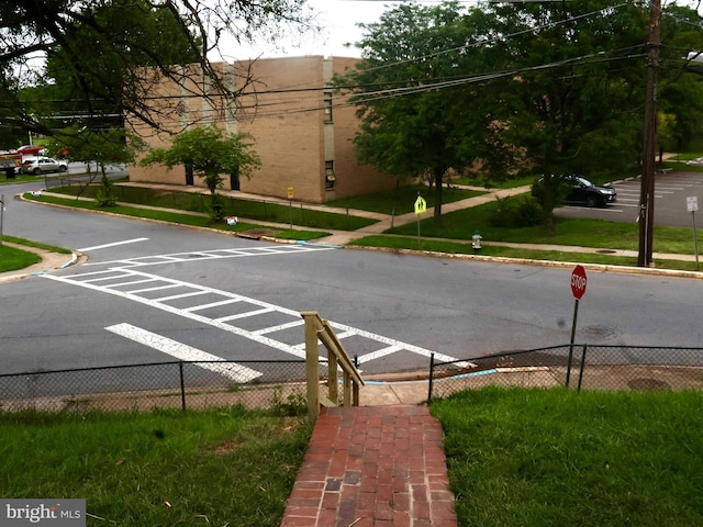 600 64th Ave, Capitol Heights, MD 20743 - view of asphalt road featuring traffic signs, curbs, and sidewalks