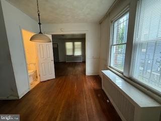 813 Sheridan St NW, Washington, DC 20011 - unfurnished dining area with wood finished floors and radiator