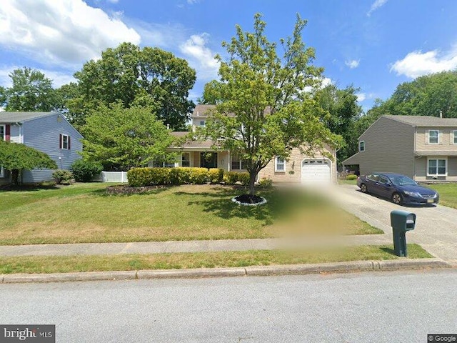 10 Jasmine Ln, Sicklerville, NJ 08081 - view of property hidden behind natural elements featuring concrete driveway, a front yard, and a garage