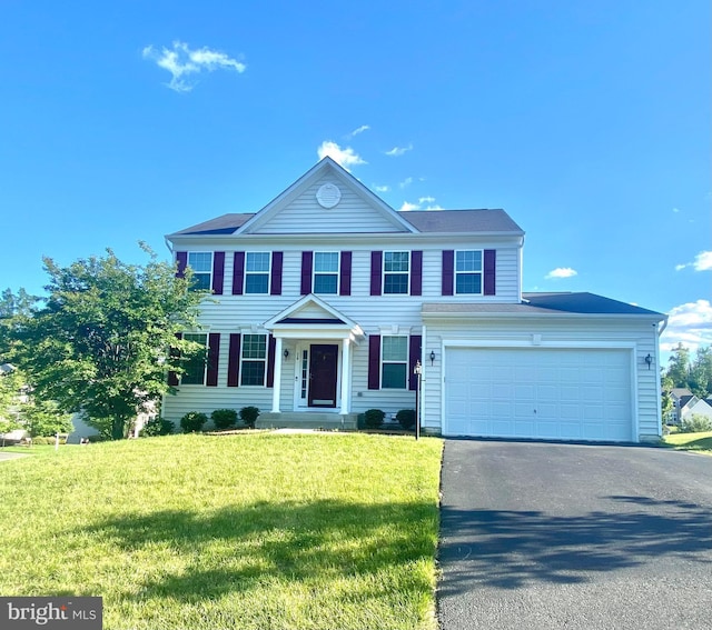 26 Colemans Mill Dr, Fredericksburg, VA 22405 - colonial-style house featuring asphalt driveway, a front yard, and an attached garage