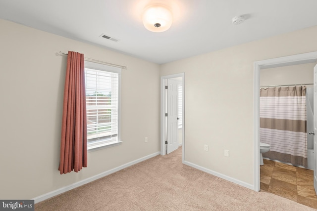 1312 S Kent St, Winchester, VA 22601 - unfurnished bedroom featuring baseboards, carpet flooring, and ensuite bathroom