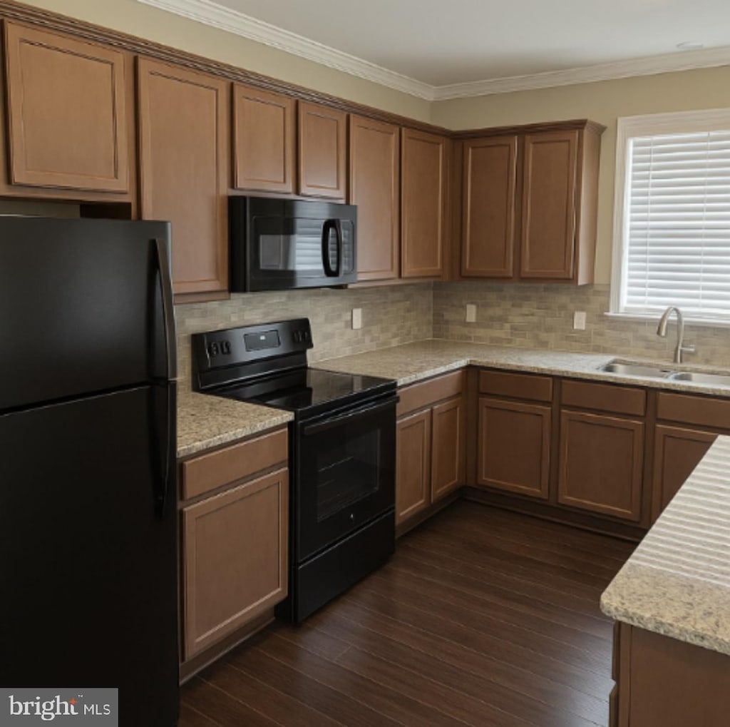 1312 S Kent St, Winchester, VA 22601 - kitchen with black appliances, dark wood-type flooring, crown molding, a sink, and backsplash