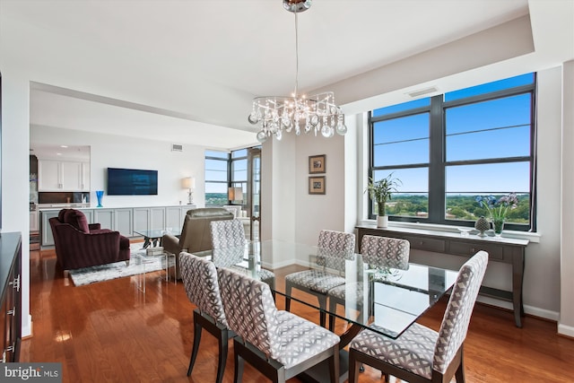 1830 Fountain Dr Unit 1107, Reston, VA 20190 - dining room with wood finished floors, healthy amount of natural light, and a chandelier