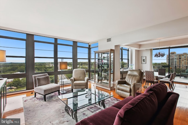 1830 Fountain Dr Unit 1107, Reston, VA 20190 - living room featuring a chandelier and wood finished floors
