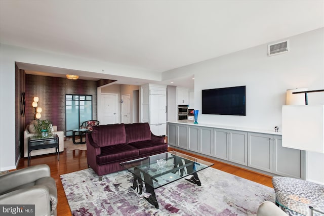 1830 Fountain Dr Unit 1107, Reston, VA 20190 - living room featuring light wood-style flooring