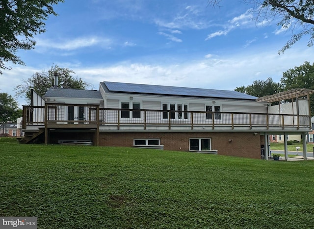 13 Montford Ct, Silver Spring, MD 20905 - back of house featuring solar panels, a yard, a wooden deck, and a pergola