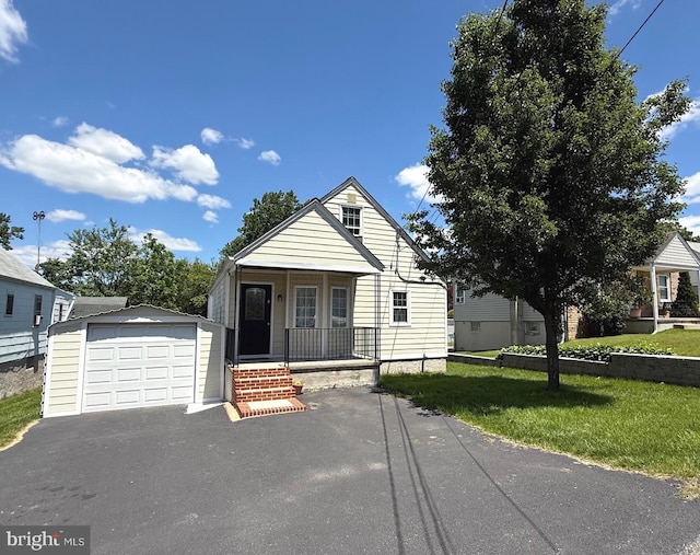 4108 Slater Ave, Baltimore, MD 21236 - view of front of property with a porch, an outdoor structure, a detached garage, driveway, and a front lawn