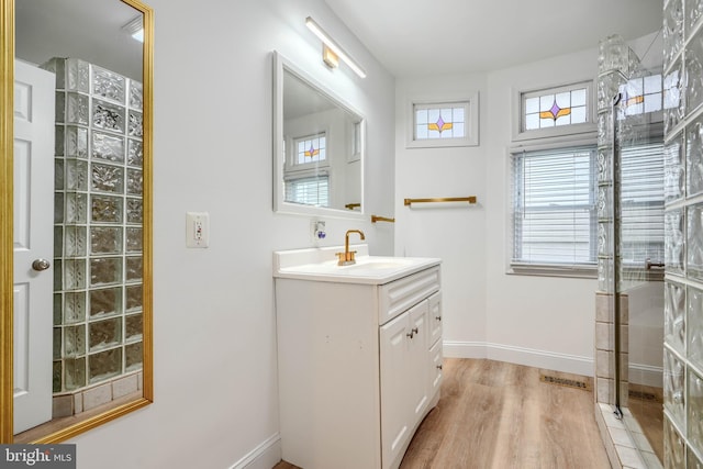 4108 Slater Ave, Baltimore, MD 21236 - bathroom featuring vanity, healthy amount of natural light, wood finished floors, and baseboards