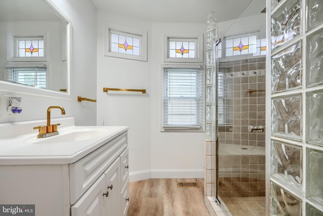 4108 Slater Ave, Baltimore, MD 21236 - full bath featuring vanity, a shower stall, healthy amount of natural light, and wood finished floors