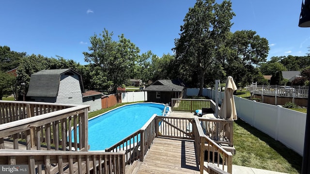 4108 Slater Ave, Baltimore, MD 21236 - view of swimming pool with a fenced backyard, a deck, and view of scattered trees