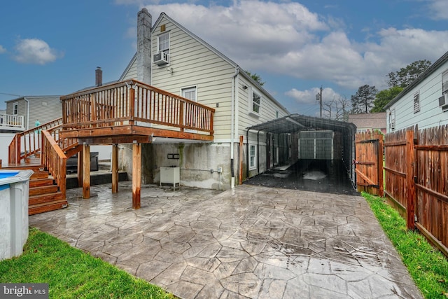 4108 Slater Ave, Baltimore, MD 21236 - rear view of house featuring a deck, a detached carport, a chimney, stairs, and cooling unit