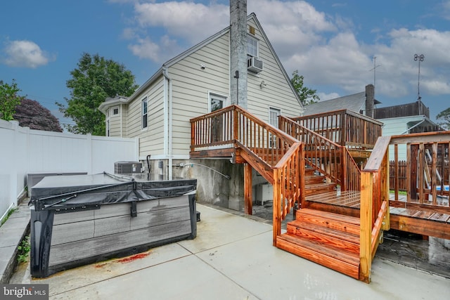 4108 Slater Ave, Baltimore, MD 21236 - rear view of property with a deck, a patio area, a hot tub, central air condition unit, and a chimney