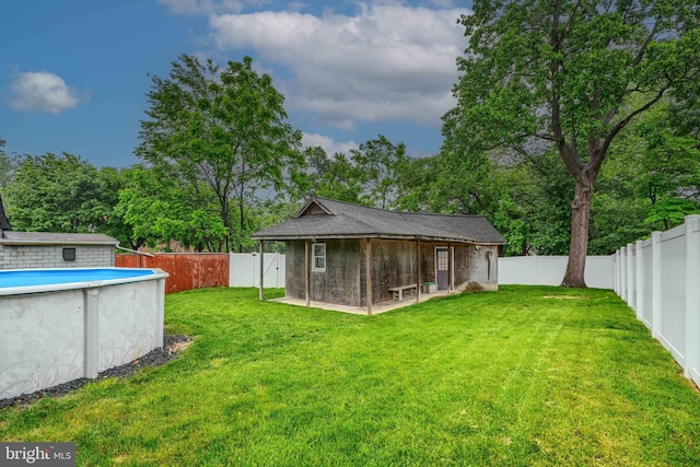 4108 Slater Ave, Baltimore, MD 21236 - view of yard featuring an outbuilding and view of wooded area