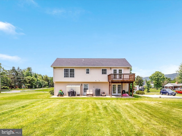 18 Barnett Dr, Front Royal, VA 22630 - back of property featuring french doors, central air condition unit, a lawn, and a wooden deck