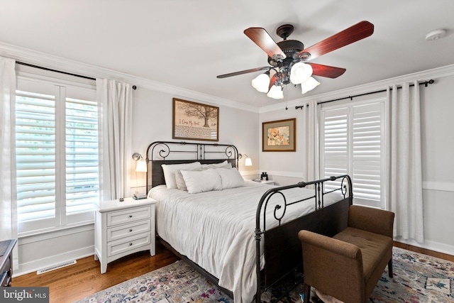 413 Benton Pt, Tappahannock, VA 22560 - bedroom featuring dark wood-type flooring, ornamental molding, baseboards, and a ceiling fan