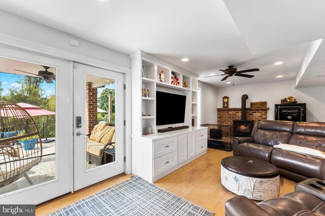 413 Benton Pt, Tappahannock, VA 22560 - living area with a ceiling fan, light wood-style floors, a wood stove, and recessed lighting