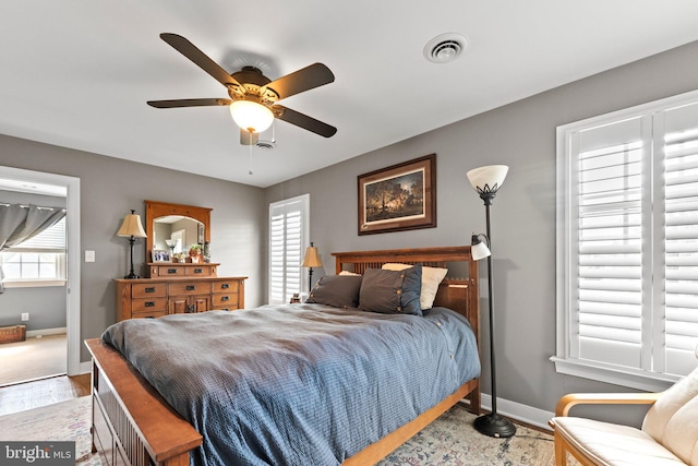 413 Benton Pt, Tappahannock, VA 22560 - bedroom with baseboards, wood finished floors, and ceiling fan