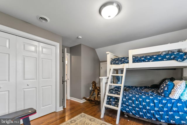 413 Benton Pt, Tappahannock, VA 22560 - bedroom featuring wood finished floors, a closet, lofted ceiling, and baseboards