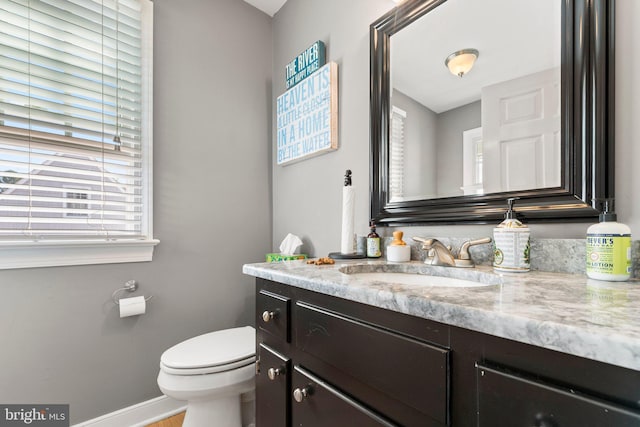 413 Benton Pt, Tappahannock, VA 22560 - bathroom featuring vanity, toilet, and baseboards