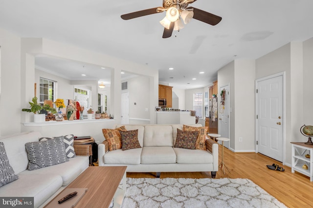 10079 Orland Stone Dr, Bristow, VA 20136 - living area with light wood-style floors, recessed lighting, ceiling fan, baseboards, and ornamental molding