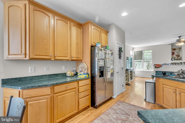 10079 Orland Stone Dr, Bristow, VA 20136 - kitchen with stainless steel fridge, light wood finished floors, dark countertops, a ceiling fan, and recessed lighting