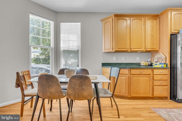 10079 Orland Stone Dr, Bristow, VA 20136 - dining area with light wood-style flooring