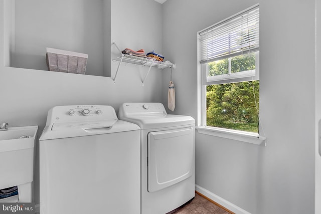 10079 Orland Stone Dr, Bristow, VA 20136 - laundry room featuring independent washer and dryer, baseboards, and tile patterned floors