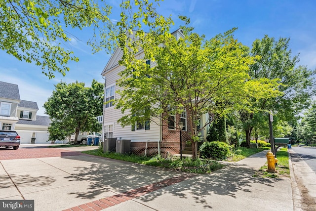 10079 Orland Stone Dr, Bristow, VA 20136 - view of side of home with central air condition unit