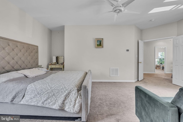 10079 Orland Stone Dr, Bristow, VA 20136 - bedroom with a skylight, carpet floors, baseboards, and a ceiling fan