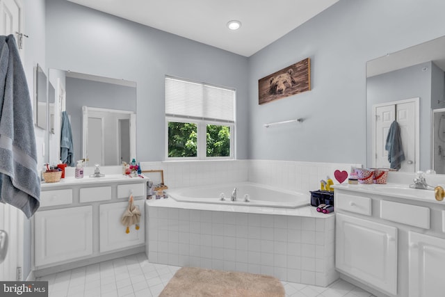 10079 Orland Stone Dr, Bristow, VA 20136 - bathroom featuring tile patterned flooring, two vanities, and a bath