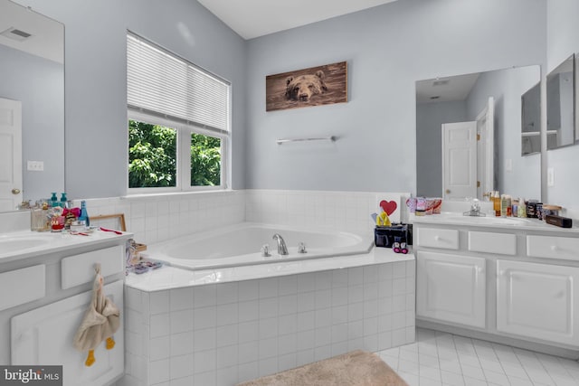 10079 Orland Stone Dr, Bristow, VA 20136 - bathroom with vanity, tile patterned flooring, and a garden tub