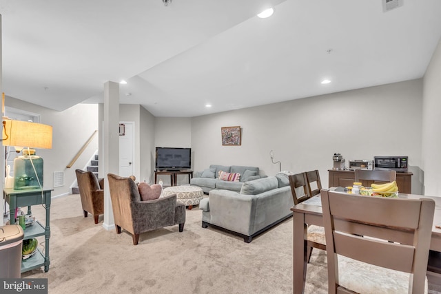 10079 Orland Stone Dr, Bristow, VA 20136 - living room with light colored carpet, stairway, and recessed lighting