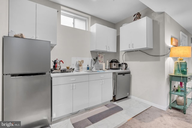 10079 Orland Stone Dr, Bristow, VA 20136 - kitchen with freestanding refrigerator, a sink, light countertops, fridge, and white cabinetry