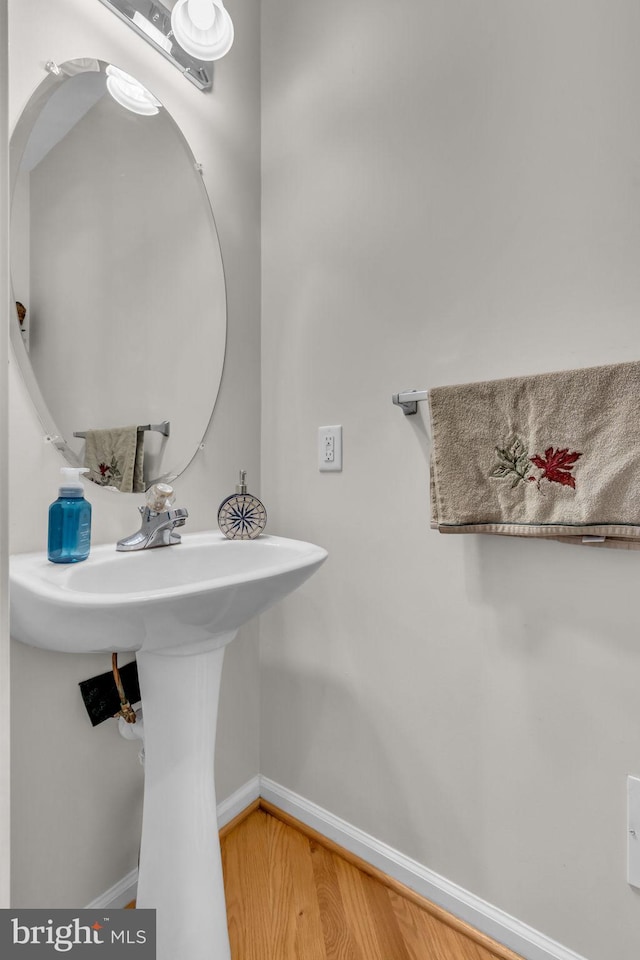 10079 Orland Stone Dr, Bristow, VA 20136 - bathroom featuring baseboards and wood finished floors