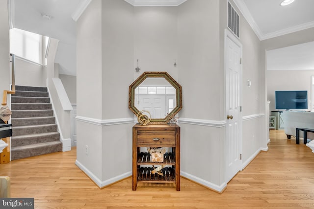 10079 Orland Stone Dr, Bristow, VA 20136 - hall featuring wood finished floors, stairs, baseboards, and crown molding
