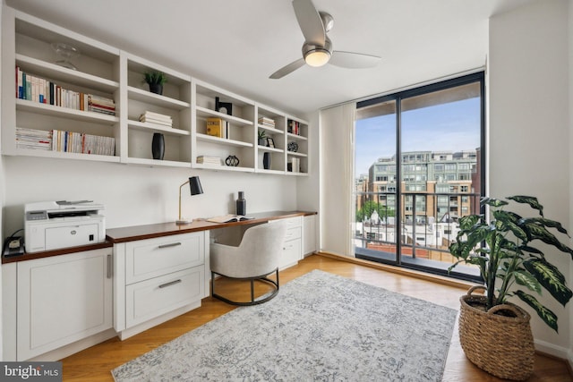 2555 Pennsylvania Ave NW Unit 918, Washington, DC 20037 - office with built in study area, a ceiling fan, light wood-type flooring, and expansive windows